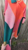 Multi coloured pleated cape dress